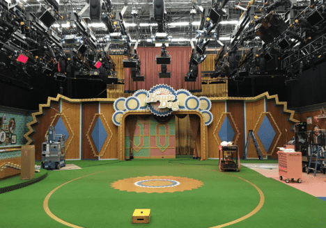 Television show set with lights hanging from above.